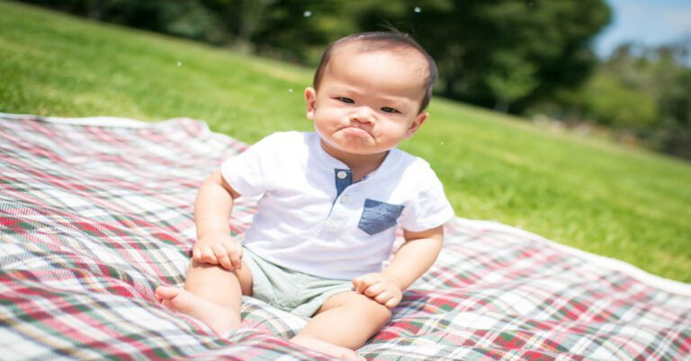 a baby on a blanket