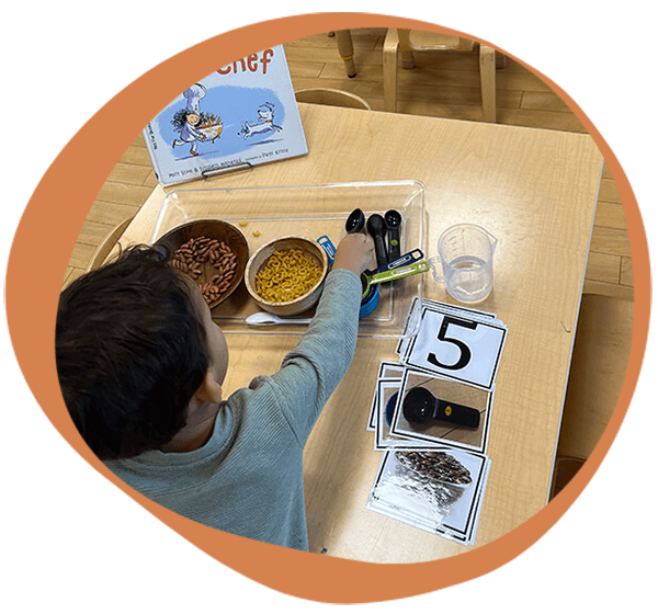 a child working on a project at one of our daycare centers