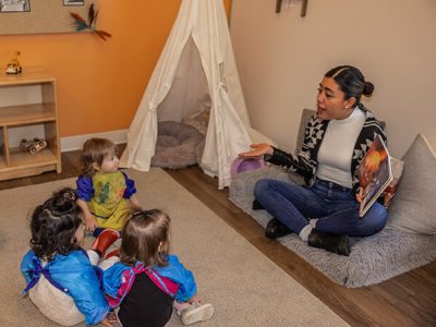 a teacher and students at one of our daycare facilities